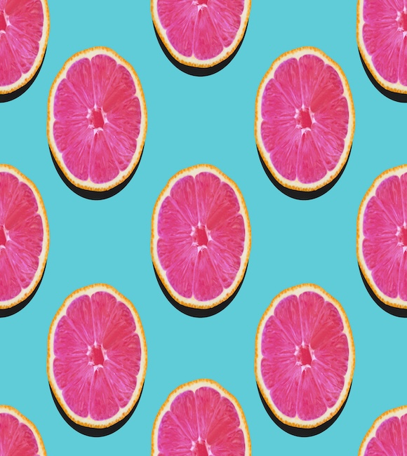 Grapefruit,in,flat,lay,fruity,pattern,of,grapefruit,with,pink