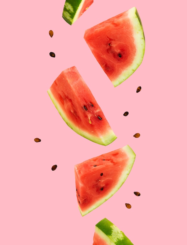 Floating,,Flying,,Levitating,Sliced,Fresh,Watermelon,On,Pink,Background.,Summer